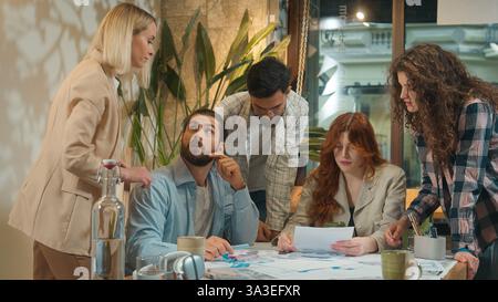 Business team creative freelance group coworkers architects partners students men women girls guys male female study talk discuss corporate startup Stock Photo