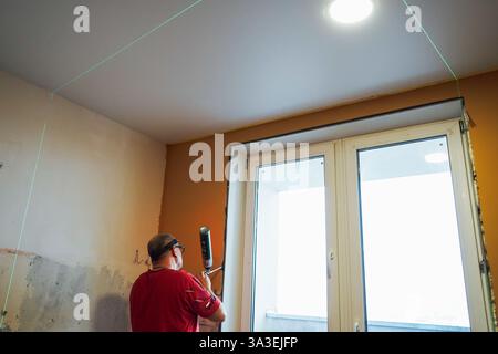 Process installation slopes of window . Using a moanting foam. Stock Photo