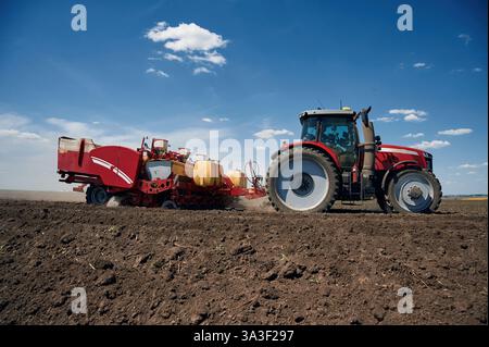 Man Riding Tractor Side View Riding, side view. Agricultural machinery, tractor on the field ...