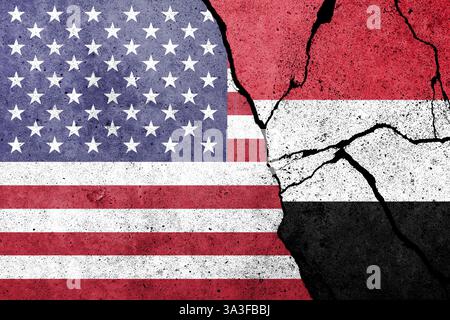 Flag of US and Yemen painted on a concrete wall with soldier shadow ...