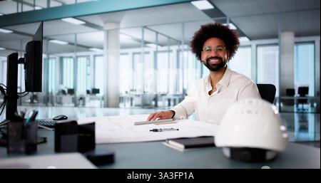 Happy African American Engineer Meeting in Office Discussing Construction Plans Stock Photo