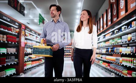 Happy Senior Couple Choosing Fresh Vegetables Together at Local Supermarket. Stock Photo