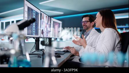Doctors use video conference to discuss lab results in webinar. Stock Photo