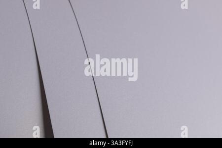 Elegant light gray paper texture with subtle striped overlay and fine edges. Premium designer material with a minimalistic and monochrome finish, perf Stock Photo