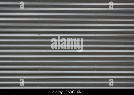 Background from a corrugated silver metal sheet Stock Photo