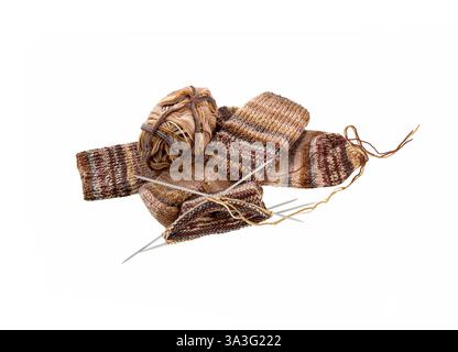 Knitted sock, ball of yarn and knitting needles on a white background. Piece of knitting socks. Top view. Stock Photo