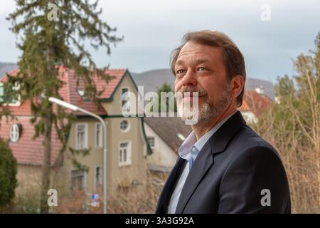 Elderly gentleman 50-55 years old in business style on the background of a cosy European town Stock Photo
