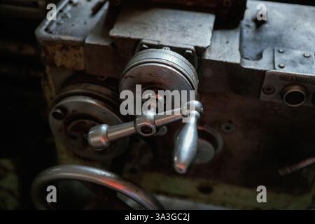 Close-up of old mechanical machinery with metal handles. Stock Photo