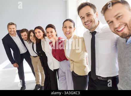 Happy laughing diverse business team, group of smiling confident office employees, professionals Stock Photo