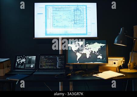 Analyzing Global Data on Multiple Digital Devices Stock Photo
