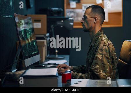 Analyzing Digital Data in Military Operations Room Stock Photo