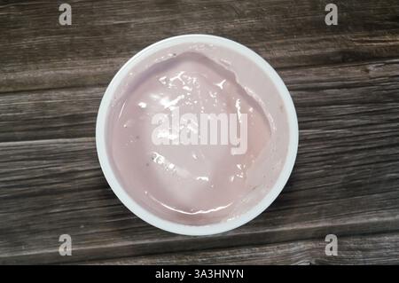 Strawberry Greek yogurt, with high in protein, and with natural taste and creamy texture with probiotics that helps to regulate the digestive system, Stock Photo