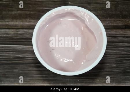 Strawberry Greek yogurt, with high in protein, and with natural taste and creamy texture with probiotics that helps to regulate the digestive system, Stock Photo