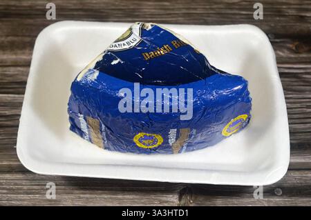 Cairo, Egypt, March 7 2025: Danablu, Danish Blue Cheese, a strong, blue-veined cheese, semi-soft creamery cheese is typically drum- or block-shaped an Stock Photo