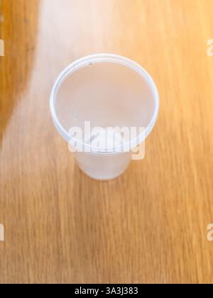 above view of empty plastic cup on office table close up Stock Photo