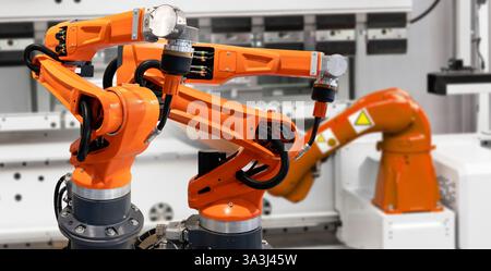 Automatic welding robots on a smart factory. Stock Photo