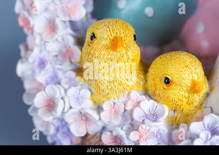 Easter chicks decoratione pastel colored flowers Stock Photo