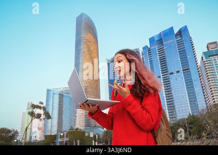 Young student having a video conference call using laptop in Abu Dhabi, United Arab Emirates Stock Photo