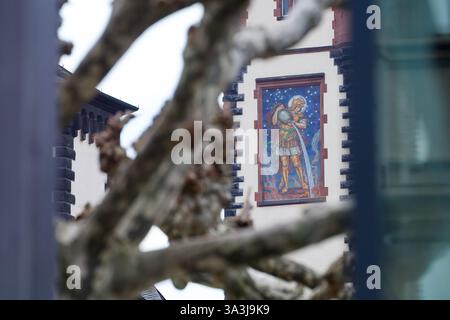 Frankfurt am Main, Germany. March 14, 2025. Glass mosaic "Saint Florian" on the town hall tower "Langer Franz" designed by Robert Forell in 1902. Stock Photo