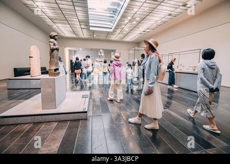 17 January 2025, Louvre museum Abu Dhabi, UAE: Tourists are visiting museum, walking and admiring ancient artifacts and statues Stock Photo