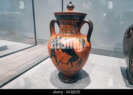 17 January 2025, Louvre museum Abu Dhabi, UAE: Close up of an ancient Greek amphora showcasing a Hercules fights with the Nemean Lion Stock Photo