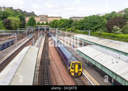 Edinburgh, UK - May 29, 2024. Train arriving at platform, Edinburgh Waverley Railway Station, UK Stock Photo