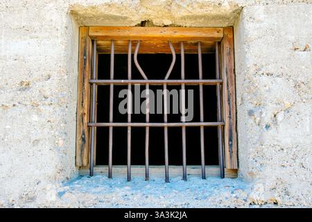 Iron bars on jail window in mining ghost town, Rhyolite, Nevada, USA Stock Photo