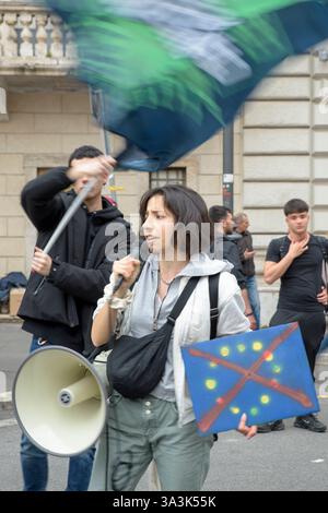 Great Rome Flag A protester holding a red flag and a megaphone decorated with a drawing ...