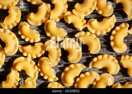 pasta creste on black wood background Stock Photo