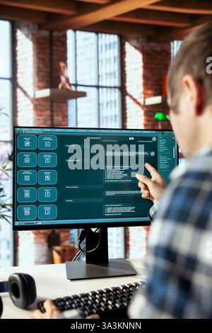 Teleworker in home office requesting aid from large language model generative AI chatbot engaging in humanlike interaction. Remote worker using artificial intelligence LLM handling user requests Stock Photo