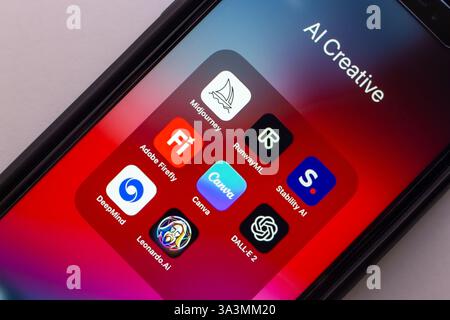 iPhone displaying Midjourney, RunwayML, Stability AI, DALL·E 2, Canva, Adobe Firefly, Leonardo.Ai, and DeepMind. AI-powered creative tools concept. Stock Photo