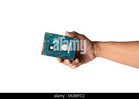 Male hand holding a hard drive HDD device isolated on white background Stock Photo