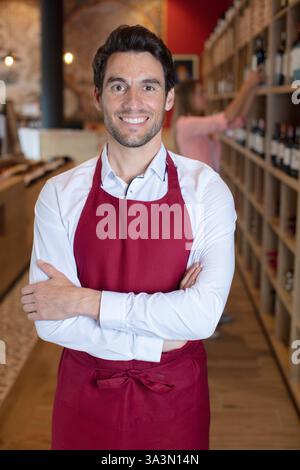 satisfied winemaker in cellar with folded hand Stock Photo