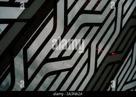 An abstract image showcasing a geometric design pattern. The pattern is formed by decorative metal grille elements, creating a modern and architectura Stock Photo