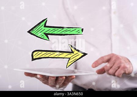 Decision concept above a tablet held by a man in background Stock Photo