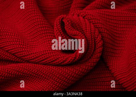Red sweater texture as a background. Top view Stock Photo