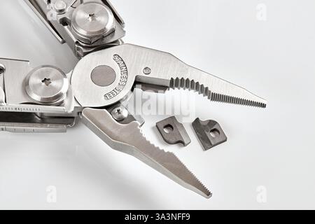 Pliers multi tool close up parts pivot point or fulcrum, pipe grip, tip, jaws or nose and handles. Jaw replacement replaceable parts for pliers. Focus Stock Photo
