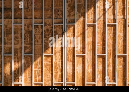 Shopwindow protective security metal grate bars on old abandoned store as urban pattern Stock Photo