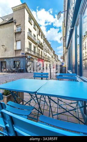Blue café tables and chairs outside restaurant on the Rue Colbert in the old quarter of Tours, Indre-et-Loire (37), France. Stock Photo