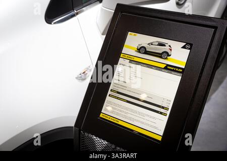 Information board for the Opel Mokka X car at the Brussels Autosalon Motor Show. Belgium - January 10, 2018. Stock Photo