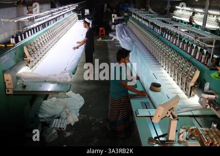 Dhaka, Bangladesh. 17th Mar, 2025. Workers produce prayer caps at a factory before Eid-ul-Fitr in Dhaka, Bangladesh, March 17, 2025. Credit: Habibur Rahman/Xinhua/Alamy Live News Stock Photo