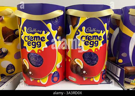 Two Cadbury Creme Egg Easter Eggs on a Tesco Supermarket shelf. Swansea, Wales, United Kingdom. 13th March 2025. Stock Photo