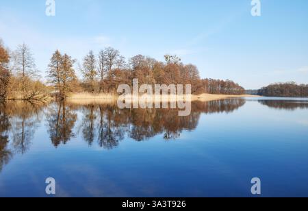 Panoramic symmetrical view of Lake Barlinek, West Pomeranian Voivodeship, Poland. Stock Photo