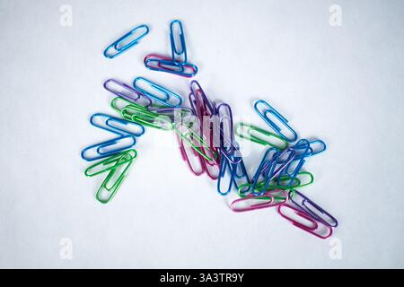 Pile of multi-colored metal paper clips Stock Photo