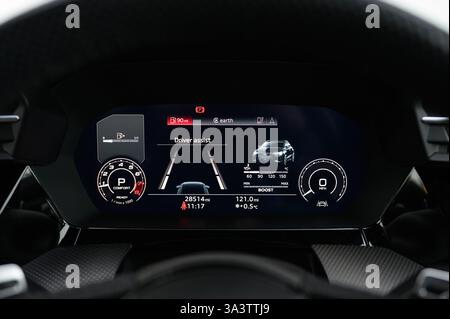 Virtual Cockpit, Digital Dashboard Displaying Map and Information About a Vehicle in Front of the Steering Wheel Including a Speedometer, Dials, Navig Stock Photo