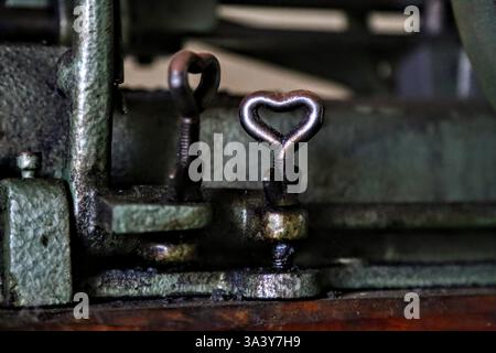 Metal Heart Wing Nut at Old Factory Stock Photo