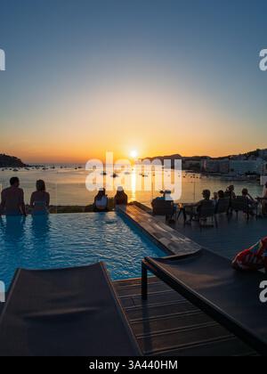 Watching mediterranean sunset from rooftop Stock Photo