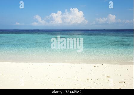 Deserted dream beach sandy beach beach deserted behind turquoise coloured turquoise coloured lagoon of island in Indian Ocean turquoise blue, on the h Stock Photo