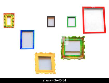 Empty multicolor photo frames isolated on white background. Collection of different painted photoframes for decorating home cutout. Variety color vint Stock Photo