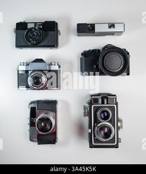 Collection of DSLR photo cameras with zoom lens in various angles ...